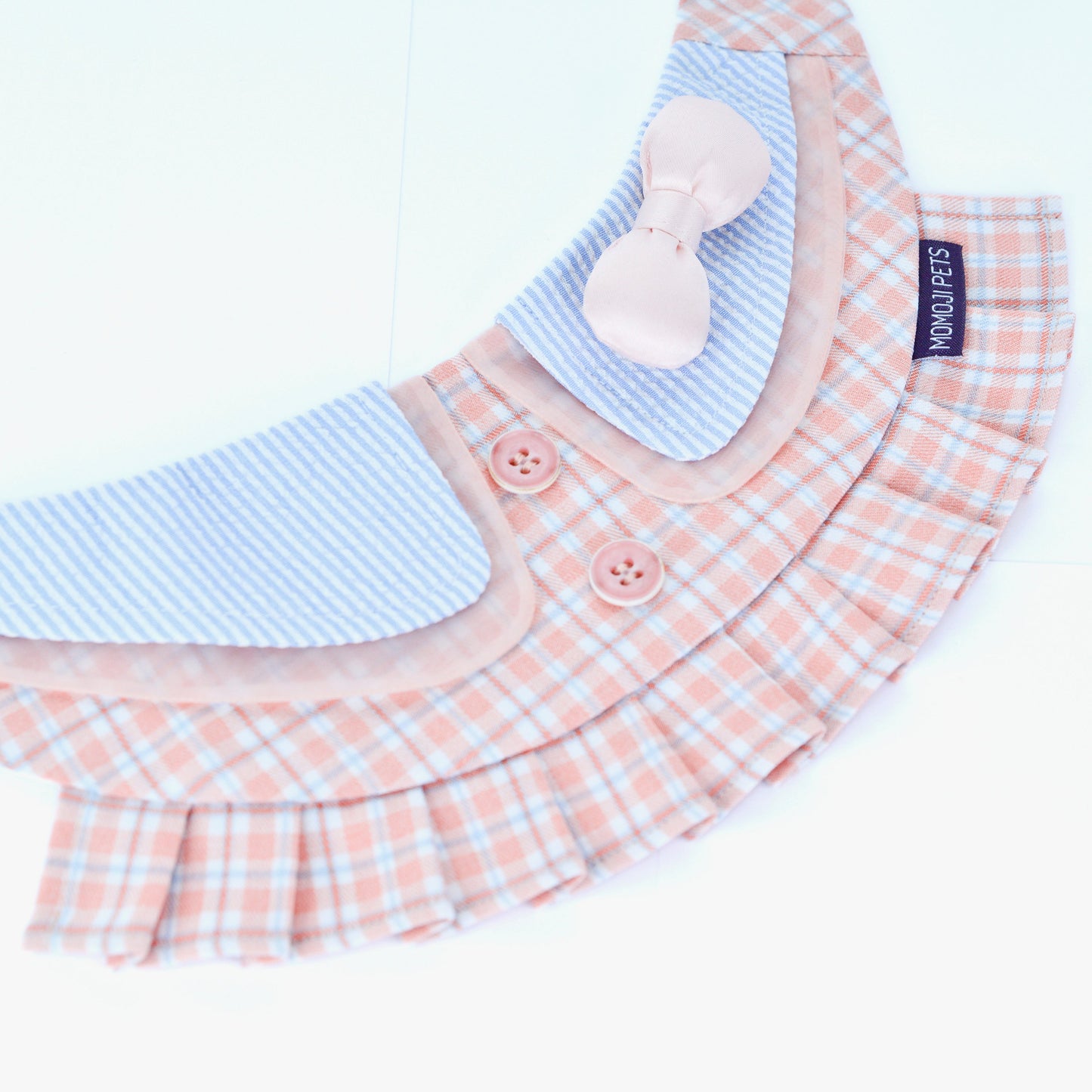 Evelyn pink plaid bandana laid open, showing the pleats