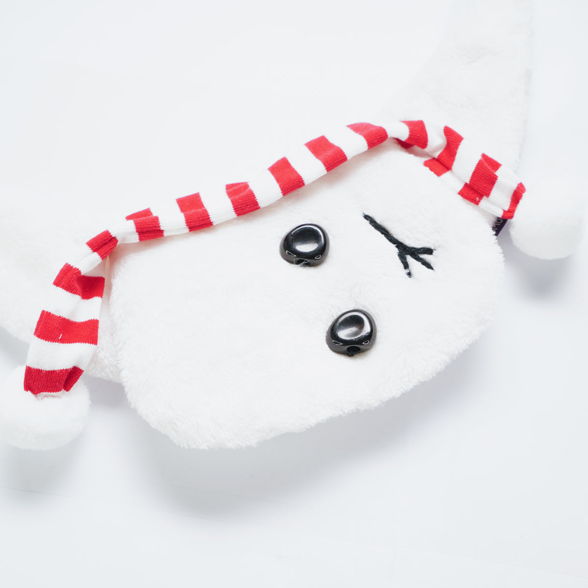 Close-up of the Momosnow bandana's striped scarf and buttons