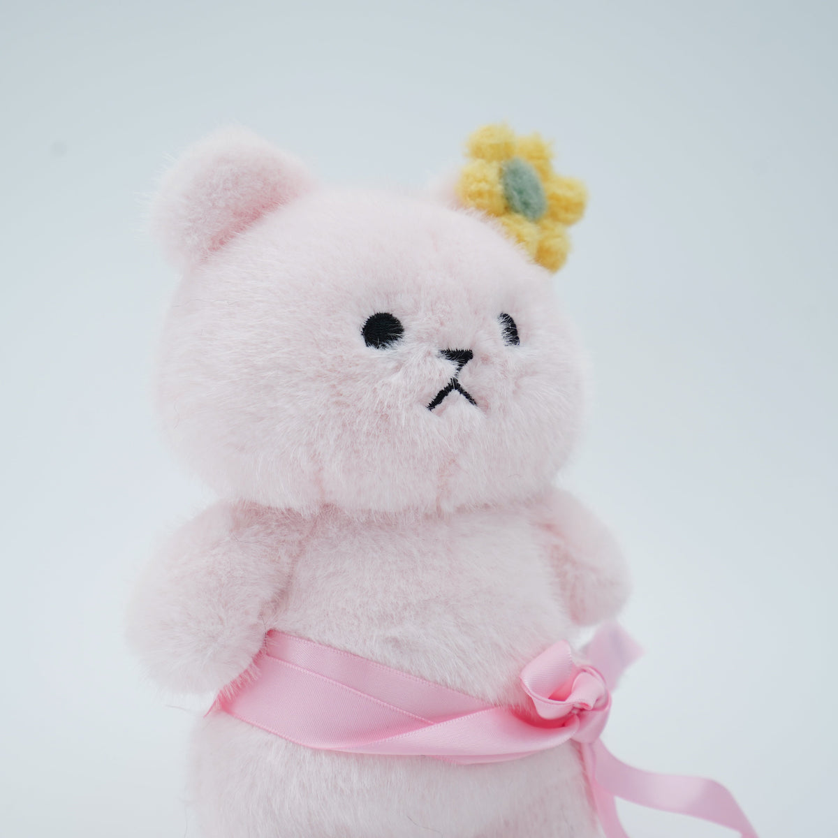 Close-up of the pink Momoji Bear plush