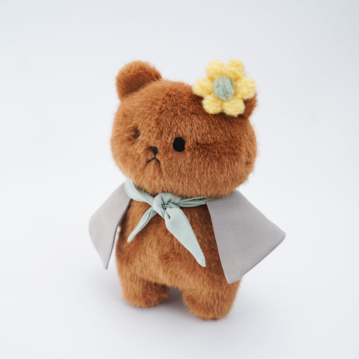 Brown Momoji Bear plush with cape, side view