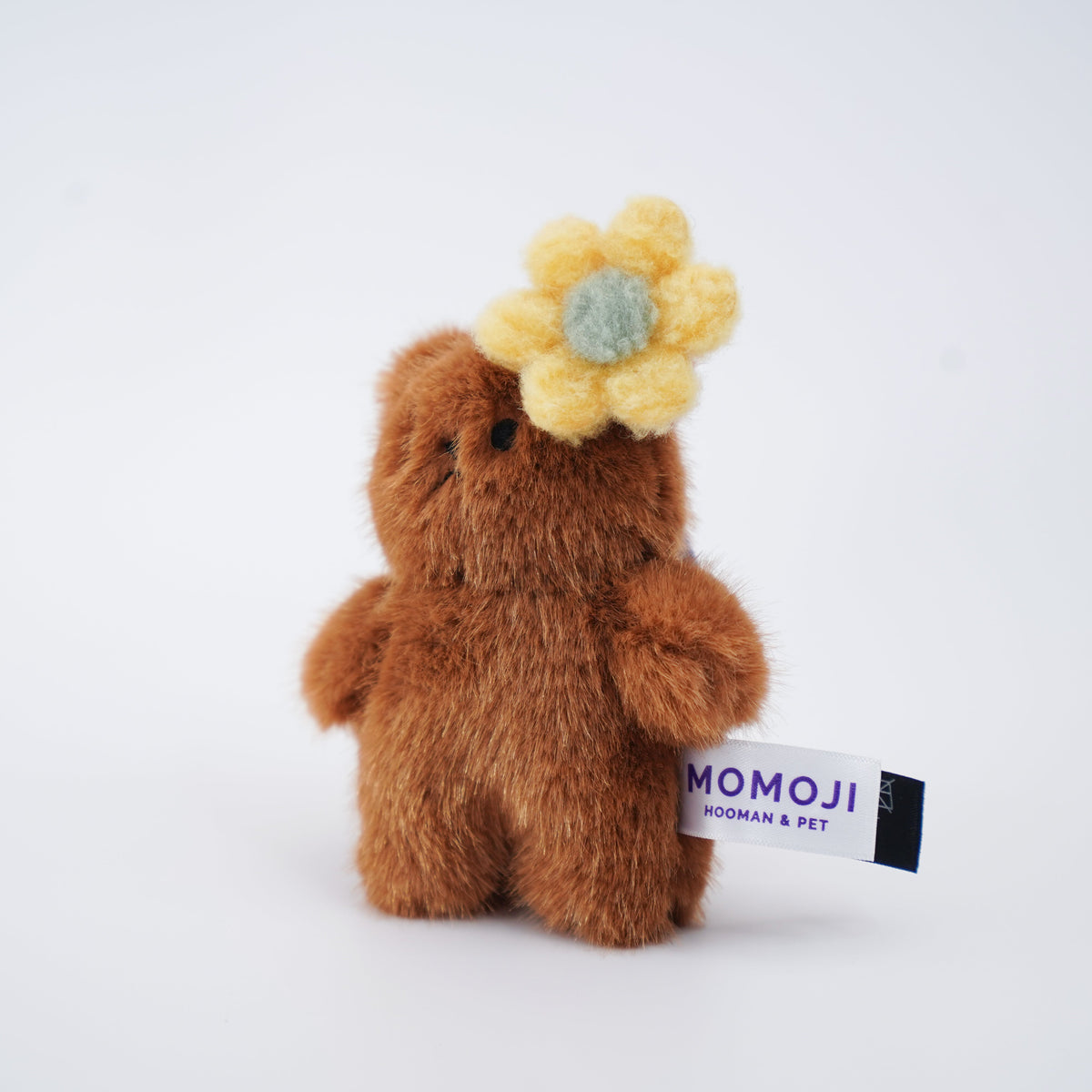 Small brown Momoji Bear plush with yellow flower clip