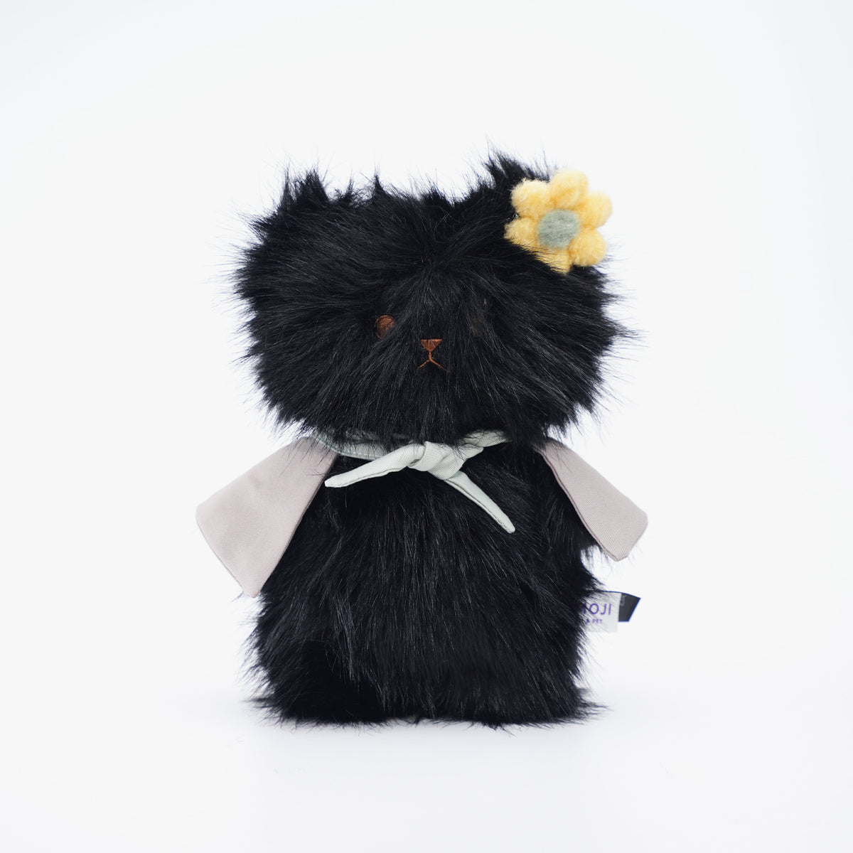 Black Momoji Bear plush with grey cape and yellow flower clip
