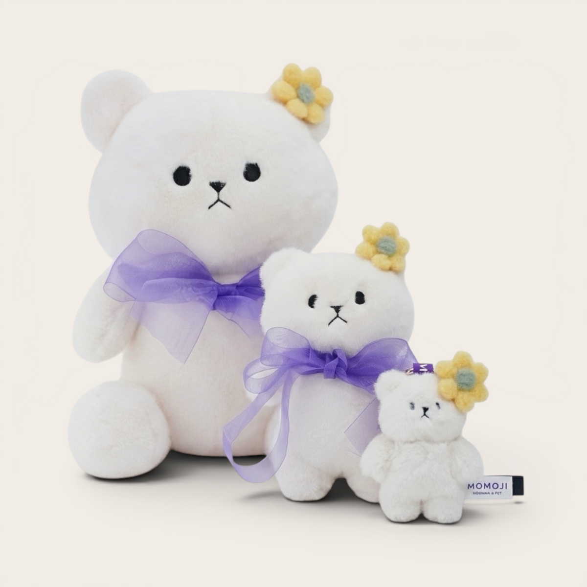 White Momoji Bear plush family in three sizes with lilac bows