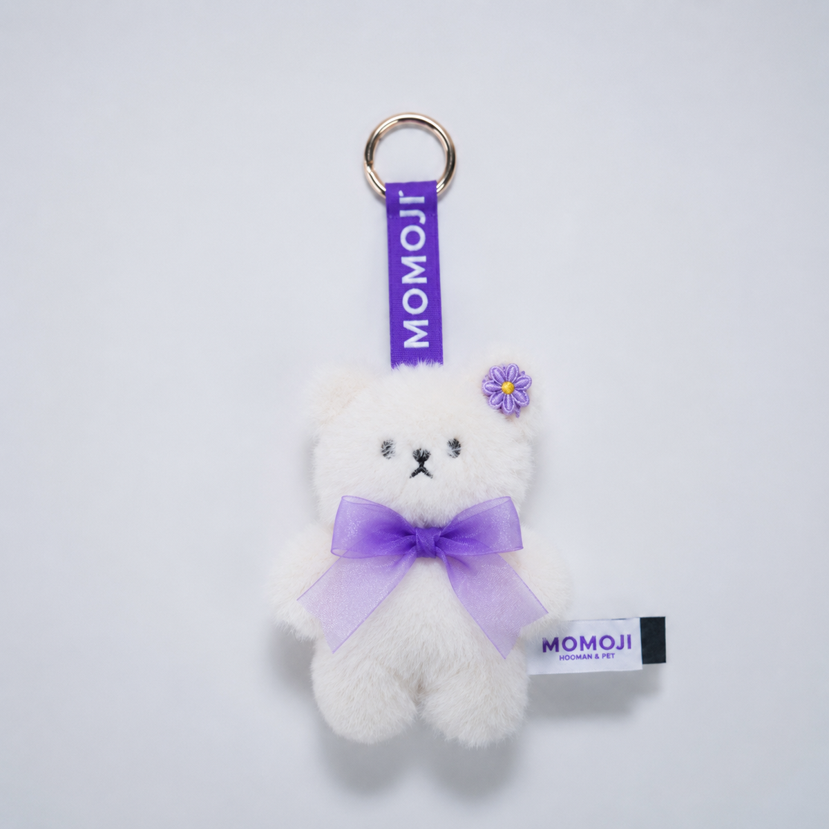 Cream Momoji Bear keyring with lilac bow and flower clip