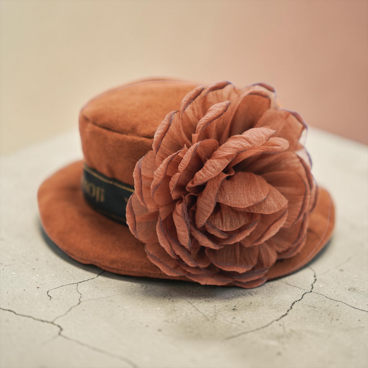 Piccadilly rust suede hat with a large fabric rose